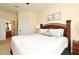 Bedroom with decorative headboard adjacent to the ensuite bathroom at 2778 Almaton Loop # 403, Kissimmee, FL 34747