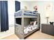 This bedroom features a bunk bed, a window, and cartoon decorations at 2778 Almaton Loop # 403, Kissimmee, FL 34747