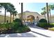 An inviting clubhouse entrance with well-maintained landscaping and a welcoming walkway to the building at 2778 Almaton Loop # 403, Kissimmee, FL 34747