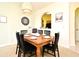 Comfortable dining area with an elegant light fixture and view into kitchen at 2778 Almaton Loop # 403, Kissimmee, FL 34747