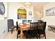 Cozy dining room adjacent to kitchen with seating for six, great for meals and gatherings at 2778 Almaton Loop # 403, Kissimmee, FL 34747