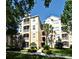 Well-maintained condo complex featuring manicured landscaping and a bright, inviting facade at 2778 Almaton Loop # 403, Kissimmee, FL 34747
