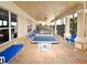 Outdoor game room featuring ping pong and pool tables, with lounge chairs and outdoor ceiling fans at 2778 Almaton Loop # 403, Kissimmee, FL 34747