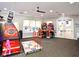 Spacious game room with Dance Dance Revolution and driving simulator arcade games at 2778 Almaton Loop # 403, Kissimmee, FL 34747