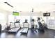 Bright gym with modern equipment: treadmills, bikes, elliptical, and stair climber machines at 2778 Almaton Loop # 403, Kissimmee, FL 34747