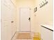 Clean, tiled hallway with closet and storage space, offering practical storage solutions at 2778 Almaton Loop # 403, Kissimmee, FL 34747