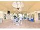 Covered outdoor seating area furnished with modern tables and chairs, providing a comfortable lounge space at 2778 Almaton Loop # 403, Kissimmee, FL 34747