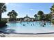Resort-style pool with large shallow area, waterslides, and palm trees at 2778 Almaton Loop # 403, Kissimmee, FL 34747