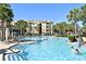 Resort-style pool with shallow area and palm trees, perfect for relaxing at 2778 Almaton Loop # 403, Kissimmee, FL 34747