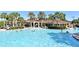 Stunning community pool surrounded by palm trees and lush landscaping at 2778 Almaton Loop # 403, Kissimmee, FL 34747
