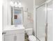 Modern bathroom showcasing a vanity with storage, toilet, and glass-enclosed shower stall, ideal for relaxation at 2821 Cathy Blvd, Winter Haven, FL 33880