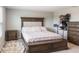 Cozy bedroom with a cushioned headboard, a storage bench at the foot of the bed, and a decorative rug at 2821 Cathy Blvd, Winter Haven, FL 33880