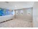 Bright bonus room boasts neutral walls, plush carpet, and three windows offering a sunny and inviting space at 2821 Cathy Blvd, Winter Haven, FL 33880
