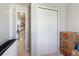Bright room featuring a bi-fold closet door with a view of the stairs and hall in a recently sold home at 2821 Cathy Blvd, Winter Haven, FL 33880