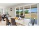 Dining area with a sliding glass door and a view of the pond and backyard at 2821 Cathy Blvd, Winter Haven, FL 33880