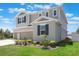 Charming two-story house featuring a three-car garage and a neatly landscaped front yard at 2821 Cathy Blvd, Winter Haven, FL 33880