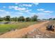 Scenic walking path with a bench overlooks a pond in a peaceful community setting at 2821 Cathy Blvd, Winter Haven, FL 33880