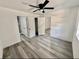 Bedroom showcasing vinyl floors, fresh paint, closet, and connecting doors to other rooms at 2831 Magnolia Ave, Sanford, FL 32773