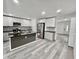 Modern kitchen with stainless steel appliances, granite countertops, and a kitchen island at 2831 Magnolia Ave, Sanford, FL 32773