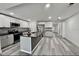 Contemporary kitchen featuring stainless steel appliances, an island, and pendant lighting at 2831 Magnolia Ave, Sanford, FL 32773