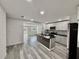 Modern kitchen with stainless steel appliances, granite countertops, and a kitchen island at 2831 Magnolia Ave, Sanford, FL 32773