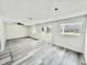 Bright and spacious living room featuring sliding glass doors and vinyl floors at 2831 Magnolia Ave, Sanford, FL 32773
