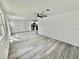 Open concept living room and kitchen featuring vinyl floors and lots of natural light at 2831 Magnolia Ave, Sanford, FL 32773