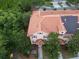 An aerial view of a townhouse featuring a terracotta-colored tile roof at 2901 Puerta Del Sol Blvd, Kissimmee, FL 34744