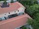 An aerial view showing the backyard of a townhouse with a screened-in patio at 2901 Puerta Del Sol Blvd, Kissimmee, FL 34744