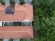 An aerial view of a townhouse featuring a terracotta-colored tile roof and screened in porch at 2901 Puerta Del Sol Blvd, Kissimmee, FL 34744