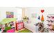 Whimsical bedroom with playful decor, toys, and colorful furnishings creating a fun and imaginative space at 2901 Puerta Del Sol Blvd, Kissimmee, FL 34744