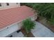 Aerial view of the garage of the townhome with a tile roof and large driveway at 2901 Puerta Del Sol Blvd, Kissimmee, FL 34744
