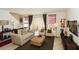 Cozy living room with neutral furniture, decorative items, and view to the backyard at 2901 Puerta Del Sol Blvd, Kissimmee, FL 34744