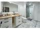 This bathroom boasts a modern vanity, walk in shower, and contemporary fixtures at 3328 Wax Berry Ct, Windermere, FL 34786