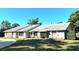 Lovely single-story home with stone accents, a well-kept lawn and manicured landscaping at 3328 Wax Berry Ct, Windermere, FL 34786