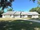 Lovely single-story home with stone accents, a well-kept lawn, and beautiful landscaping at 3328 Wax Berry Ct, Windermere, FL 34786