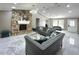 Inviting living room with stone fireplace, elegant sofas, marble floors, and a modern chandelier at 3328 Wax Berry Ct, Windermere, FL 34786