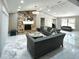 Bright living room featuring a stone fireplace, elegant sofas, marble floors, and an open concept layout at 3328 Wax Berry Ct, Windermere, FL 34786