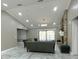 Inviting living room with stone fireplace, elegant sofas, marble floors, and natural light at 3328 Wax Berry Ct, Windermere, FL 34786