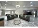 Spacious living room with stylish sofas, high ceilings, and an open floor plan leading to another room at 3328 Wax Berry Ct, Windermere, FL 34786