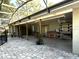 Open patio area perfect for entertaining with stone flooring and lots of natural light at 3328 Wax Berry Ct, Windermere, FL 34786