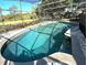 Screened-in pool area with stone surround and ample space for outdoor entertaining at 3328 Wax Berry Ct, Windermere, FL 34786
