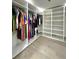 Spacious walk-in closet, featuring custom shelving and ample storage space for organized wardrobe management at 3328 Wax Berry Ct, Windermere, FL 34786