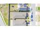 Aerial view showcases the property and neighborhood, highlighting a rooftop solar panel installation at 3451 Monaco Ln, Davenport, FL 33897
