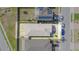 Property aerial view revealing landscape, backyard and solar panel installation at 3451 Monaco Ln, Davenport, FL 33897