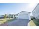 Charming single-Gathering home with a brick driveway, lush lawn, and well-maintained landscaping at 3451 Monaco Ln, Davenport, FL 33897