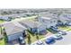Aerial view showcasing a residential neighborhood with well-maintained homes, some equipped with solar panels at 3451 Monaco Ln, Davenport, FL 33897
