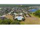 Community aerial view with a swimming pool and playground next to a pond and neighborhood at 3890 Prairie Reserve Blvd, Orlando, FL 32824