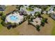 Overhead shot of community pool, clubhouse, and playground in a well-maintained neighborhood at 3890 Prairie Reserve Blvd, Orlando, FL 32824