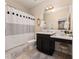 Cozy bathroom with a vanity, toilet, bathtub, and stylish shower curtain at 3890 Prairie Reserve Blvd, Orlando, FL 32824